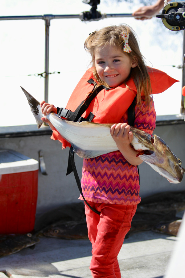 a girl with a halibut